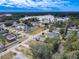 Aerial view of neighborhood near a lake, showing houses and roads at 3054 Shallowford St, Deltona, FL 32738