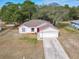 One-story house with attached garage and large yard, aerial view at 3054 Shallowford St, Deltona, FL 32738