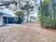 Simple backyard with a mostly flat, sandy area at 3054 Shallowford St, Deltona, FL 32738