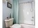 Bathroom with shower/tub, toilet and light blue walls at 3054 Shallowford St, Deltona, FL 32738