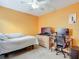 Bedroom with a bed, workspace, and ceiling fan at 3054 Shallowford St, Deltona, FL 32738