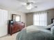 Bedroom with dresser, ceiling fan and window at 3054 Shallowford St, Deltona, FL 32738