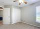 Spacious bedroom featuring double door closet and ceiling fan at 3054 Shallowford St, Deltona, FL 32738