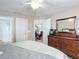 Main bedroom with dresser and view of dining area at 3054 Shallowford St, Deltona, FL 32738