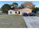 House exterior showcasing a two-car garage and well-maintained lawn at 3054 Shallowford St, Deltona, FL 32738