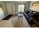 Living Room with leather couch and large window at 3054 Shallowford St, Deltona, FL 32738