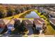 Aerial view of houses near a pond, showcasing a desirable neighborhood at 308 Willowbay Ridge St, Sanford, FL 32771