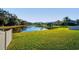 Large backyard with pond view and privacy fence at 308 Willowbay Ridge St, Sanford, FL 32771