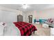 Cozy bedroom with a comfy bed, dresser, and seating area at 308 Willowbay Ridge St, Sanford, FL 32771