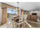 Bright dining area with table and chairs, overlooking the pool at 308 Willowbay Ridge St, Sanford, FL 32771