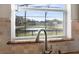 Kitchen sink with pond view from window at 308 Willowbay Ridge St, Sanford, FL 32771