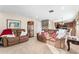 Bright and airy living room with two brown leather sofas, and kitchen views at 308 Willowbay Ridge St, Sanford, FL 32771