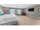 Main bedroom with a large TV and comfortable seating at 308 Willowbay Ridge St, Sanford, FL 32771