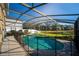 Screened pool with lake view and safety fence at 308 Willowbay Ridge St, Sanford, FL 32771