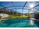 Serene screened pool overlooking a peaceful lake at 308 Willowbay Ridge St, Sanford, FL 32771