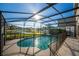 Inviting screened pool with a tranquil lake view at 308 Willowbay Ridge St, Sanford, FL 32771