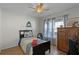 Cozy bedroom featuring a twin-size bed and a wooden dresser at 313 Dirksen Dr # B16, Debary, FL 32713