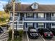 Two-story building with gray siding, balconies, and parking at 313 Dirksen Dr # B16, Debary, FL 32713