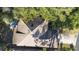 Aerial view of a home's roof and surrounding trees at 360 Gleneagles Dr, New Smyrna Beach, FL 32168