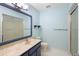 Updated bathroom with a shower, toilet, and vanity with a large mirror at 360 Gleneagles Dr, New Smyrna Beach, FL 32168