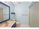 Updated bathroom with a shower, toilet, and vanity with a large mirror at 360 Gleneagles Dr, New Smyrna Beach, FL 32168