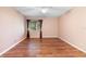 Bedroom with hardwood floors and window with curtains at 360 Gleneagles Dr, New Smyrna Beach, FL 32168