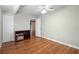 Simple bedroom with wood floors and a built-in bookshelf at 360 Gleneagles Dr, New Smyrna Beach, FL 32168