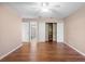 Bedroom with hardwood floors, ceiling fan and large closet at 360 Gleneagles Dr, New Smyrna Beach, FL 32168