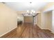 Bright dining room with hardwood floors and a chandelier at 360 Gleneagles Dr, New Smyrna Beach, FL 32168