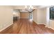 Bright dining room with wood floors and built-in bar at 360 Gleneagles Dr, New Smyrna Beach, FL 32168