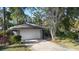 Single-story home with a one-car garage and landscaped yard at 360 Gleneagles Dr, New Smyrna Beach, FL 32168