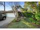 Single-story house with attached garage and lush landscaping at 360 Gleneagles Dr, New Smyrna Beach, FL 32168