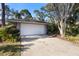 Single-story house with attached garage and mature landscaping at 360 Gleneagles Dr, New Smyrna Beach, FL 32168