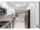 Modern kitchen with granite countertops and stainless steel appliances at 360 Gleneagles Dr, New Smyrna Beach, FL 32168