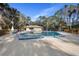 Community pool with lounge chairs and a pool house at 360 Gleneagles Dr, New Smyrna Beach, FL 32168