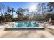 Community pool with lounge chairs and a shaded area at 360 Gleneagles Dr, New Smyrna Beach, FL 32168