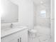 Clean bathroom with white cabinetry, marble tile, and bathtub at 368 Famagusta Dr, Davenport, FL 33896