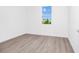 Simple bedroom with wood-look floors and window at 368 Famagusta Dr, Davenport, FL 33896