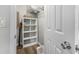 Closet with shelving unit, laundry basket and vacuum at 3724 S Atlantic Ave # 30, Daytona Beach, FL 32118