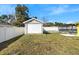 Backyard featuring fenced yard, shed, and screened patio at 40 Lantana Dr, Debary, FL 32713