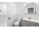 Bathroom with marble-style tiles, shower, modern vanity and fixtures at 40 Lantana Dr, Debary, FL 32713