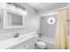 Bright bathroom with white vanity, mosaic tiled shower and tub combination at 40 Lantana Dr, Debary, FL 32713