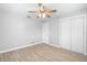 Bedroom with a ceiling fan, closet, and tile flooring at 40 Lantana Dr, Debary, FL 32713