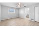 Bright bedroom featuring tile floors, ceiling fan, and natural light at 40 Lantana Dr, Debary, FL 32713