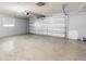 Spacious garage with a concrete floor and automatic door at 40 Lantana Dr, Debary, FL 32713