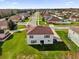 Two story house with a red roof and large backyard in a residential neighborhood at 413 Country Cottage Ln, Winter Garden, FL 34787