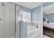 Bathroom with shower, bathtub, and window at 413 Country Cottage Ln, Winter Garden, FL 34787