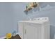 Laundry room with washer, dryer, and overhead shelving at 413 Country Cottage Ln, Winter Garden, FL 34787