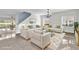 Bright living room with ample seating, tile floors, and an elegant chandelier at 413 Country Cottage Ln, Winter Garden, FL 34787