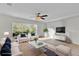 Inviting living room with natural light, comfortable seating, and modern decor at 413 Country Cottage Ln, Winter Garden, FL 34787